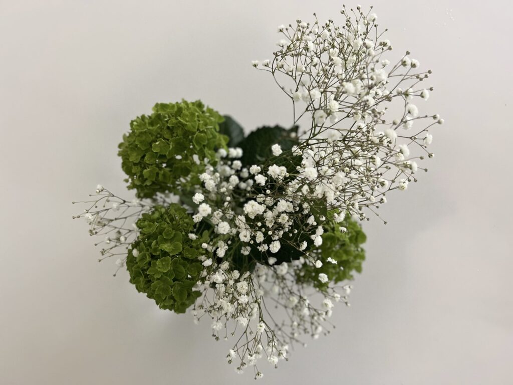 The baby's breath, added randomly with one large bunch in the center