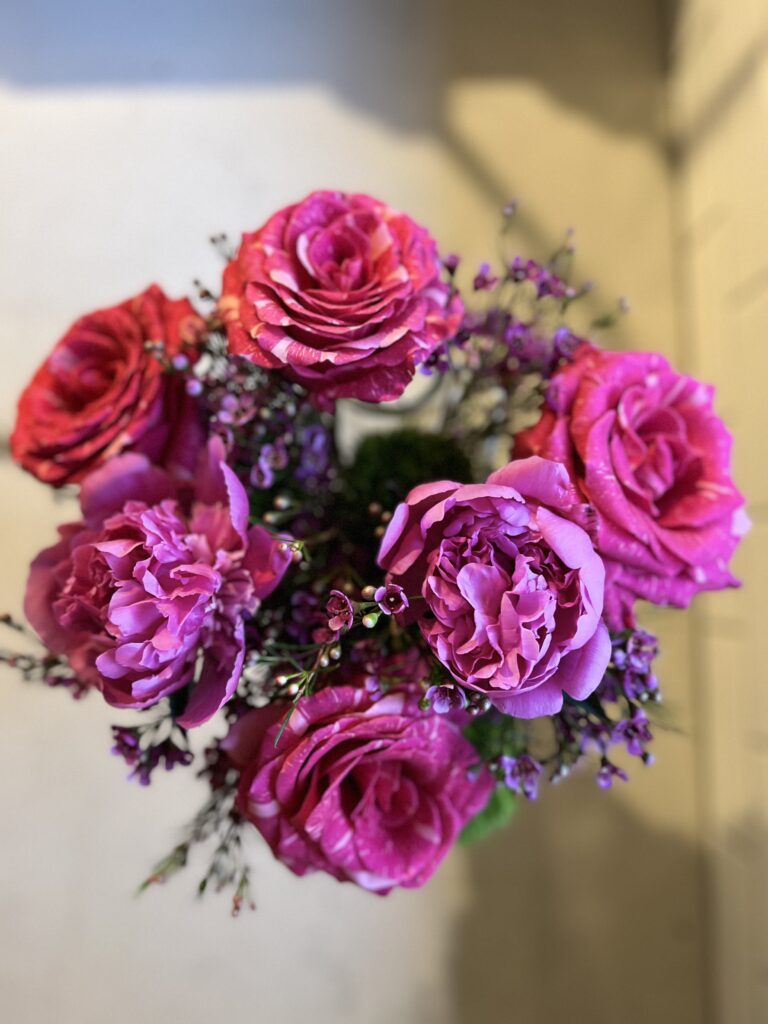 As a last step, the peonies are trimmed at staggered lengths and placed randomly as accents